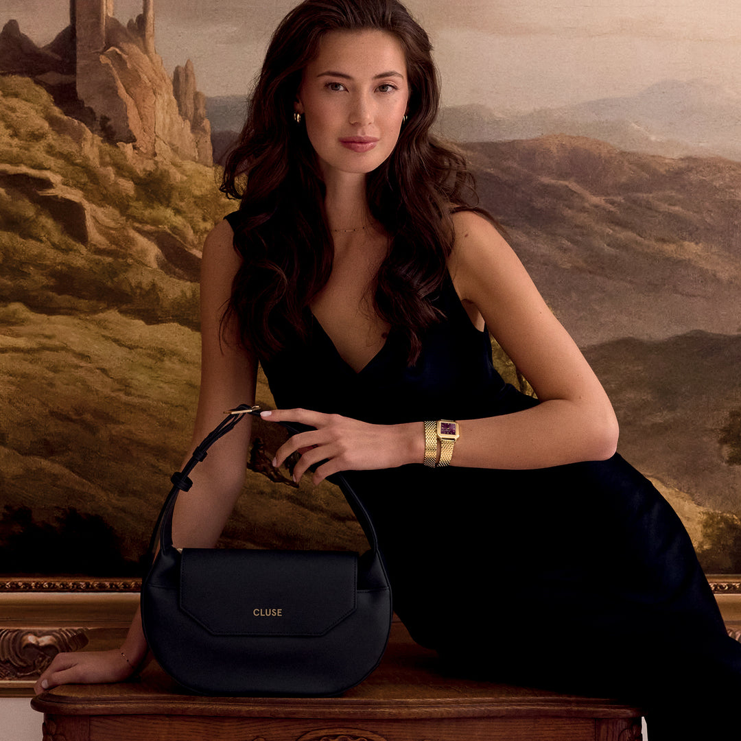 CLUSE Sacroisé Crossbody Bag, Black, Gold Colour CX04901 - Bag worn by model