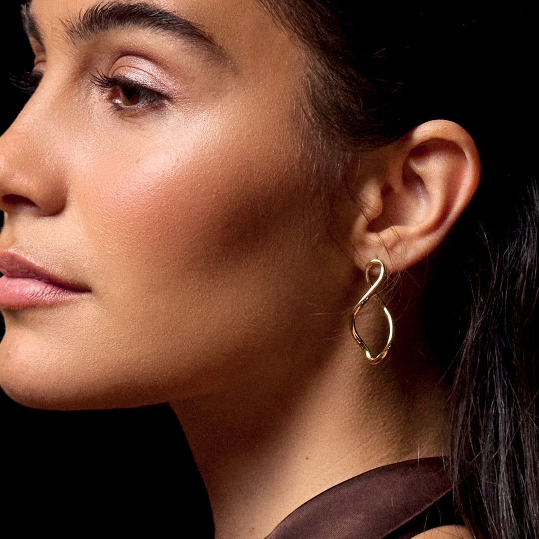 CLUSE Élevé Twisted Hoop Earrings, Gold Colour CE13355 - Earrings on model