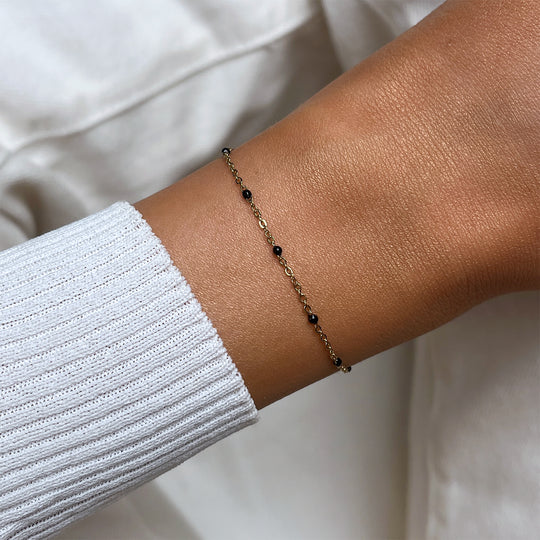 CLUSE Essentielle Black Epoxy Bracelet, Gold Colour CB13376 - Bracelet on wrist