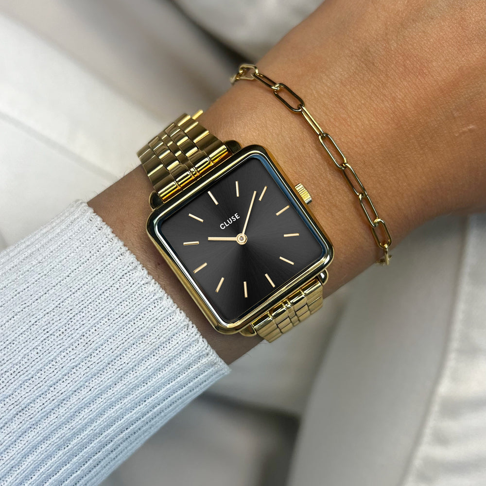 CLUSE Gift Box La Tétragone Black Steel Watch & Paperclip Chain Bracelet, Gold Colour CG10325 - front wristshot image