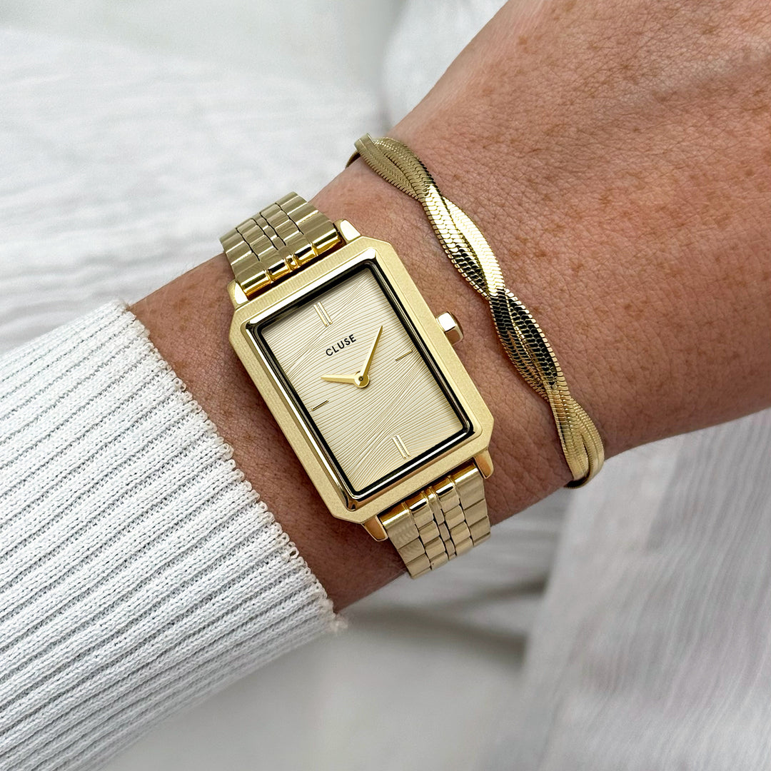 CLUSE Gift Box Fluette Watch Steel, Sand Texture &amp; Twisted Snake Bracelet, Gold Colour - CG11509 - Watch and bracelet on wrist