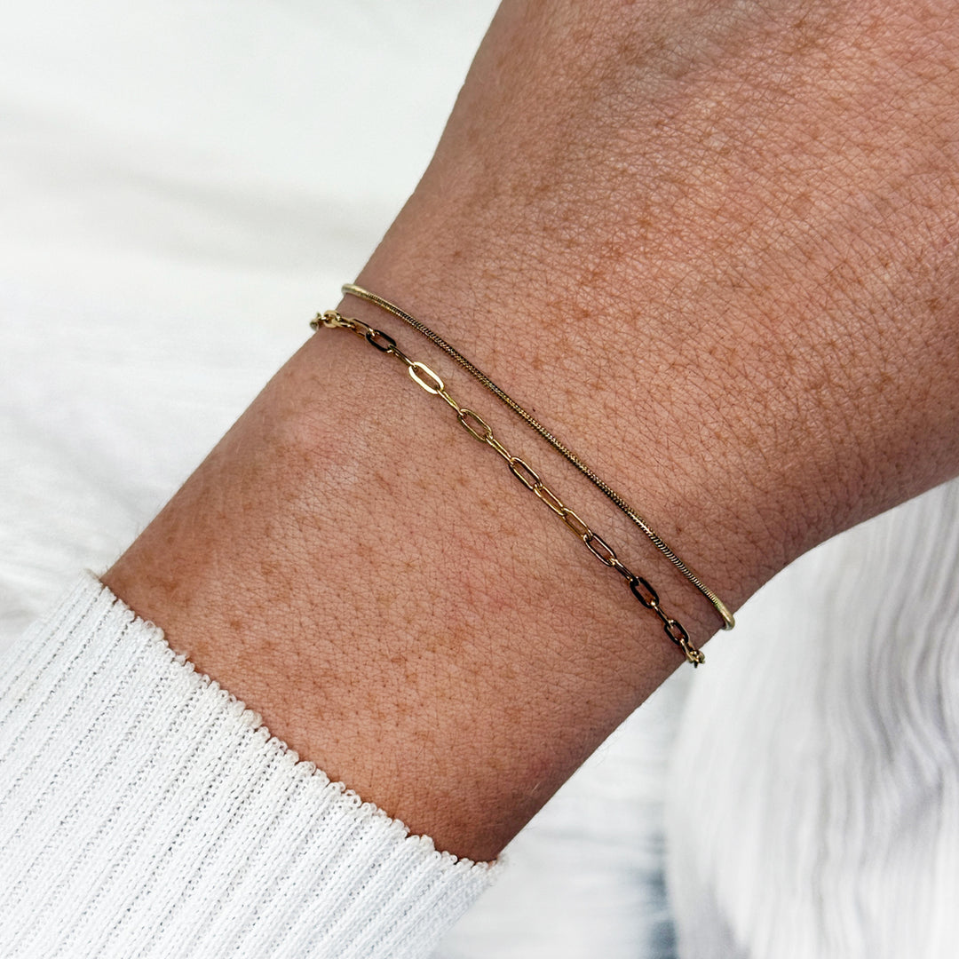 CLUSE Essentielle Paperclip & Round Snake Chain Bracelet Set, Gold Colour CG13303 - Bracelet on wrist