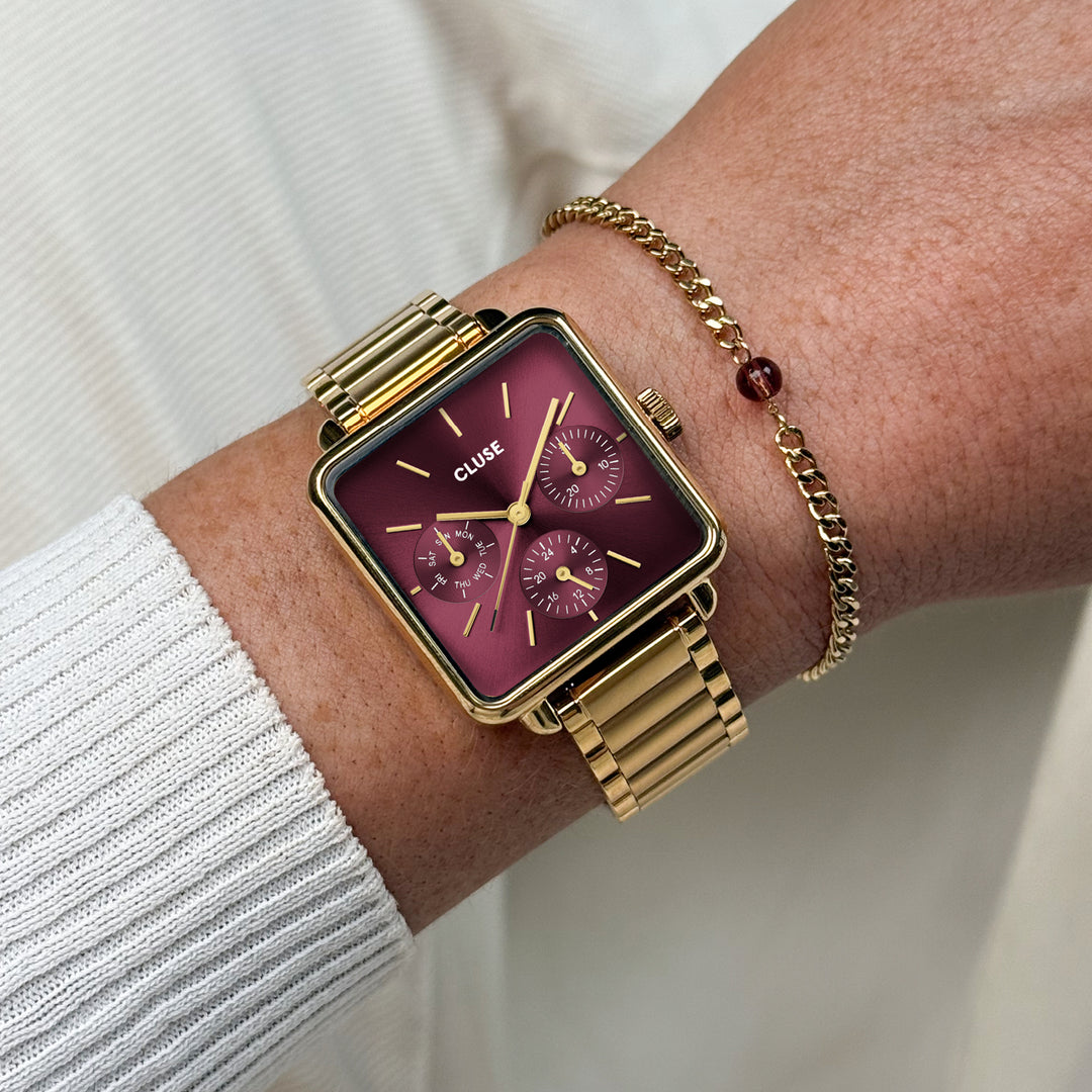 CLUSE Gift Box La Tétragone Multifunction Watch Steel, Dark Cherry & Bead Bracelet, Gold Colour CG13801 - watch and bracelet on wrist