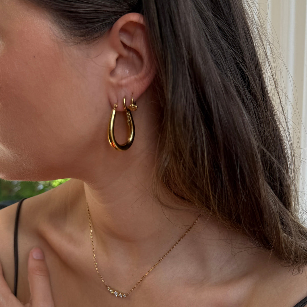 CLUSE Essentielle Drop Hoop Earrings, Gold Colour CE13360 - Earrings on model