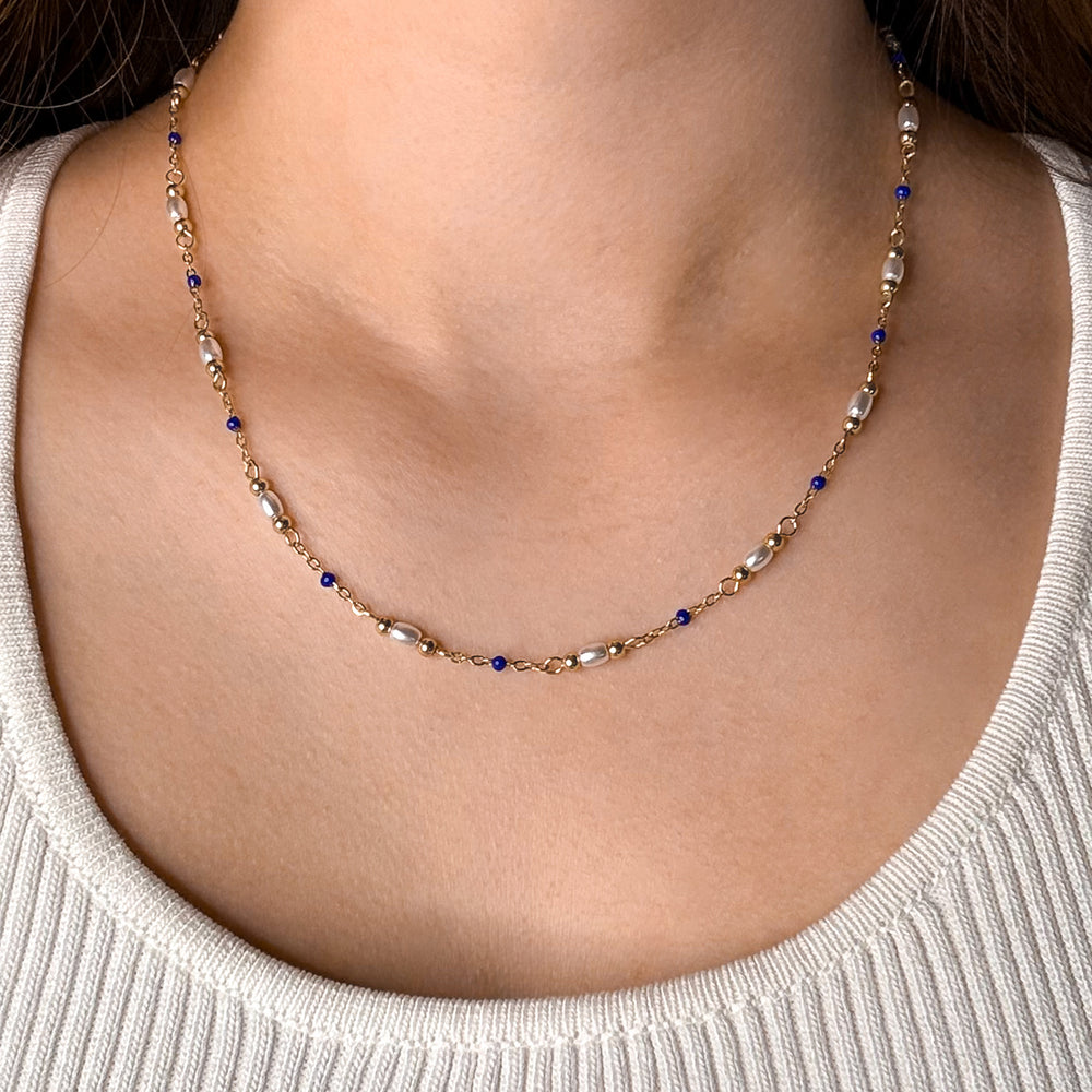 CLUSE Élevé Pearl & Blue Epoxy Chain Necklace, Gold Colour CN13326 - necklace on model.