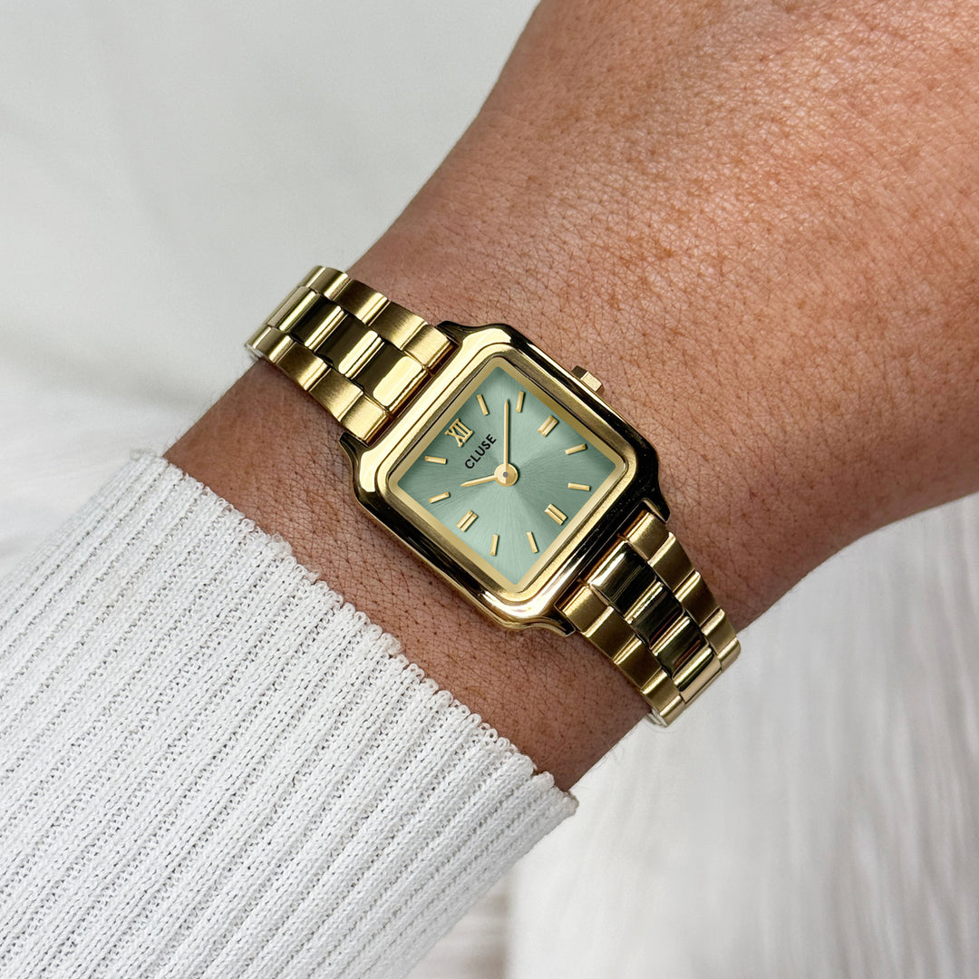 CLUSE Gracieuse Mini Watch Steel, Sage Green, Gold Colour CW15505 - Watch on wrist