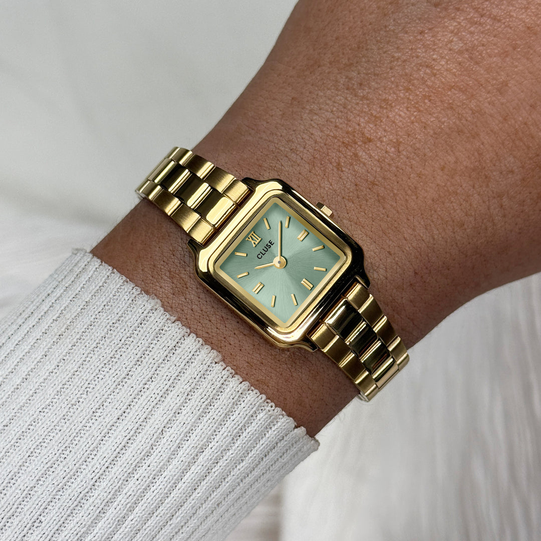 CLUSE Gracieuse Mini Watch Steel, Sage Green, Gold Colour CW15505 - Watch on wrist