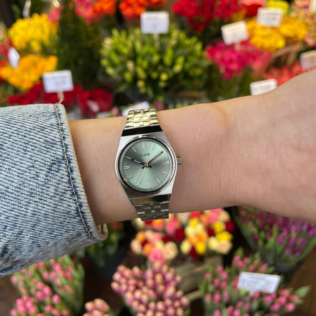 CLUSE Retro 70s Mini Watch Steel, Sage Green, Silver Colour CW16301 - Watch on model