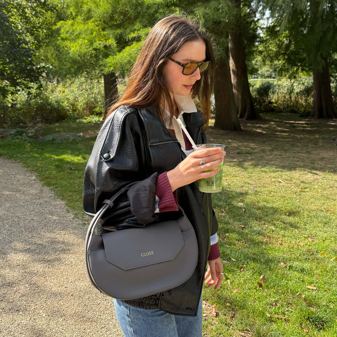 CLUSE Sacroisé Crossbody Bag, Dark Grey, Gold Colour CX04903 - model wearing bag