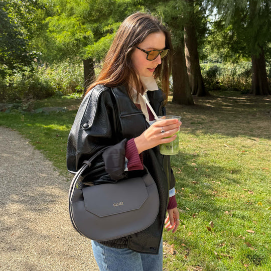 CLUSE Sacroisé Crossbody Bag, Dark Grey, Gold Colour CX04903 - model wearing bag