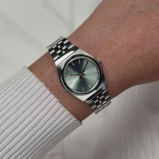 CLUSE Retro 70s Mini Watch Steel, Sage Green, Silver Colour CW16301 - Moving wrist shot