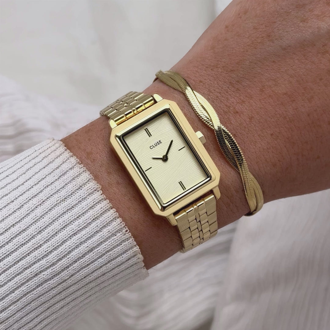 CLUSE Gift Box Fluette Watch Steel, Sand Texture &amp; Twisted Snake Bracelet, Gold Colour - CG11509 - Moving wrist shot with watch and bracelet