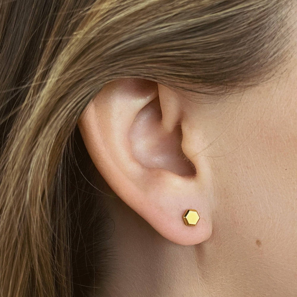 CLUSE Essentielle Hexagon Stud Earring, Gold Colour CE13326 - Earrings on the ear