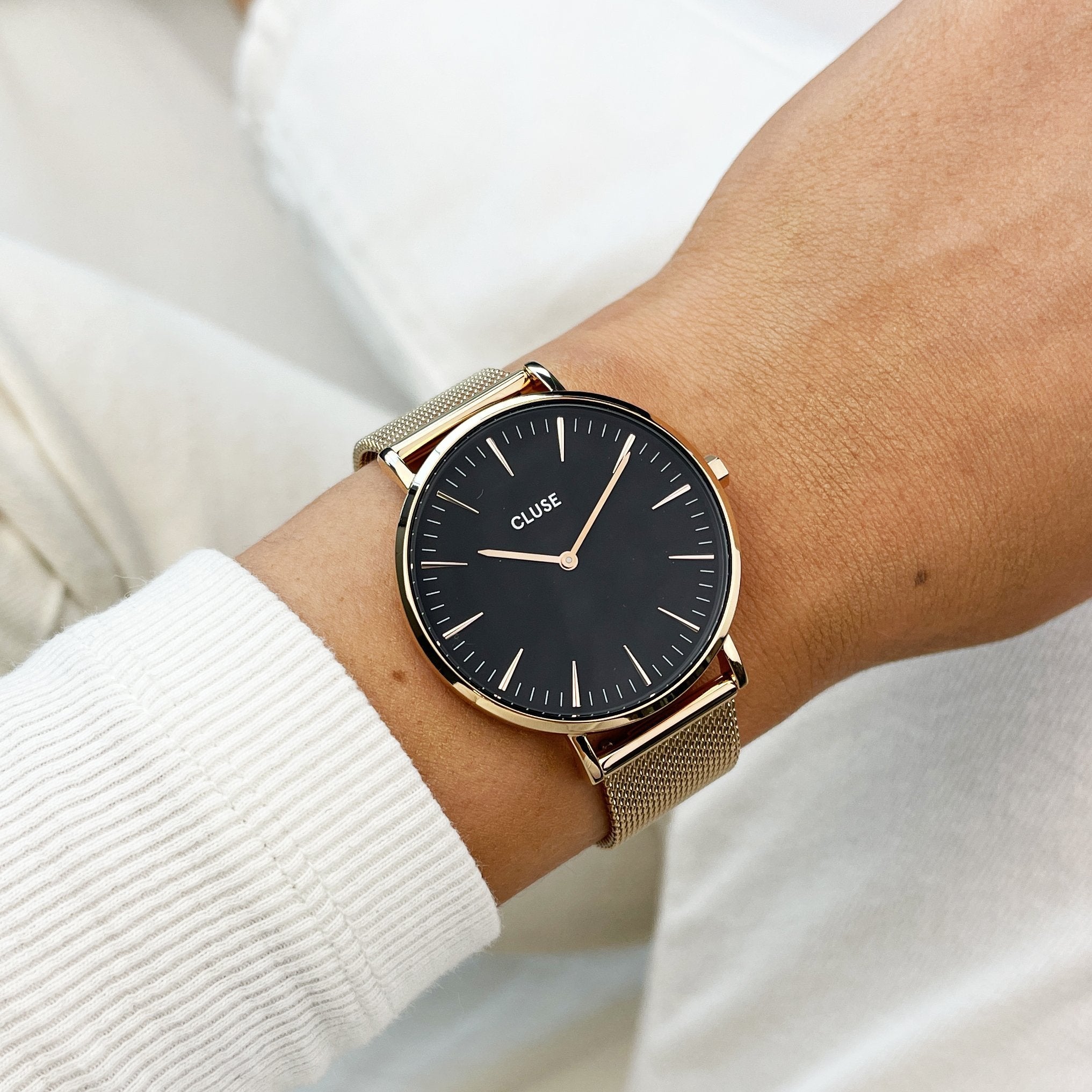 Rose gold watch clearance with black strap